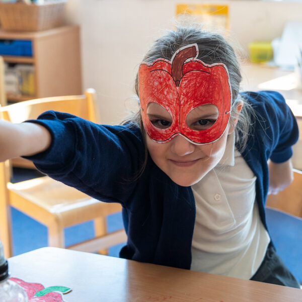 Girl with pepper mask superhero pose Henry Fawcett - square supporters sign up
